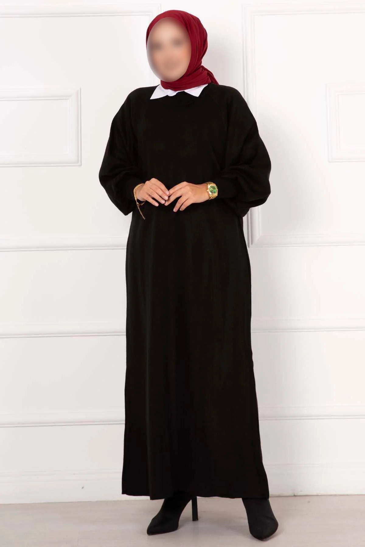 Vestido de punto negro con mangas abullonadas